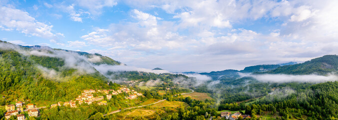 Tuscany Morning Atmosphere with fog and mist. Beautiful Aerial Panorama