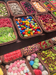 Colorful array of candies displayed at a vibrant market in the afternoon