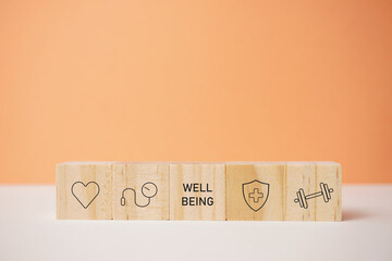 Holistic wellness and fitness concept. Wooden blocks showcasing icons for health, prevention, and...