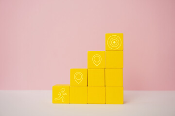 Goal achievement and progress visualization concept. Yellow blocks with icons representing steps...