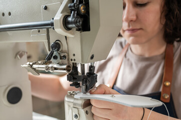 Woman tanner at work in the workshop. 