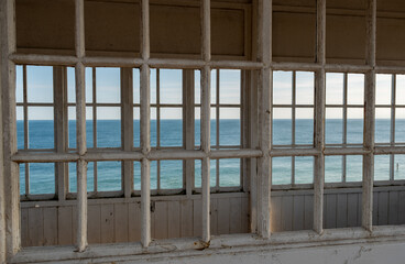 View of the ocean from the beach shelter with selective focus
