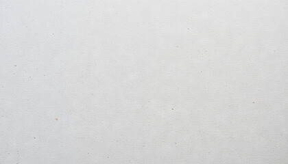 A blank canvas is placed on a clean surface in an artist's studio, waiting for colors and creativity to transform its plainness into a masterpiece. The lighting is soft and inviting