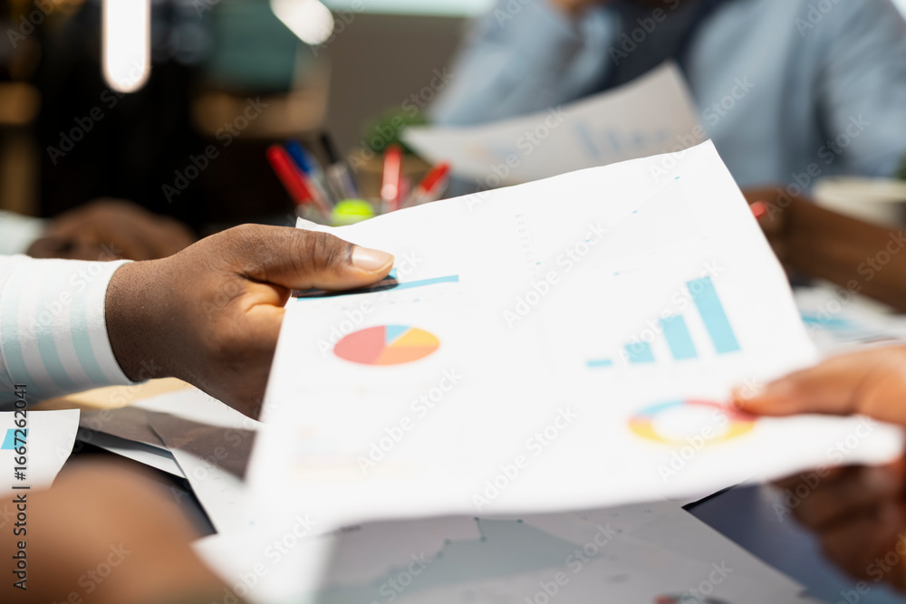 Poster close up of diverse business staff exchanging reports files and insights to forecast company objecti
