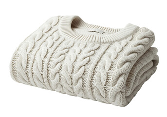 A folded cable-knit sweater displays a soft, neutral cream color against a plain black background.