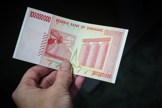 Stockholm, Sweden - Nov 15, 2024: One hundred million dollar banknote of Zimbabwe. Hyperinflation in Zimbabwe. Largest denomination currency. Monetary crisis. Worthless money.