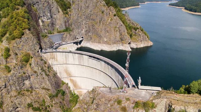 Barajul Vidraru Dam on Transfagarasan Highway, Romania. Aerial panoramic drone view from above, top view from drone . Summer holidays in Europe. The most beautiful road in the world, amazing scenery v