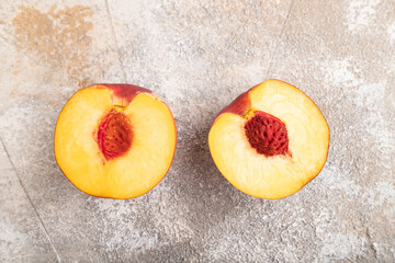 Peach Cut in half on brown concrete, Top view, close up