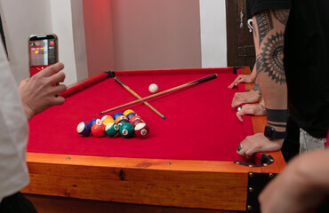 Pool Game in Progress Billiard Table Setup with Players