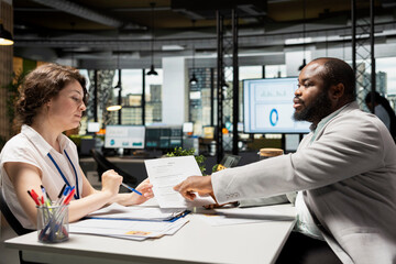 HR manager and job seeker discuss personal and professional benefits package such as salary, rights...