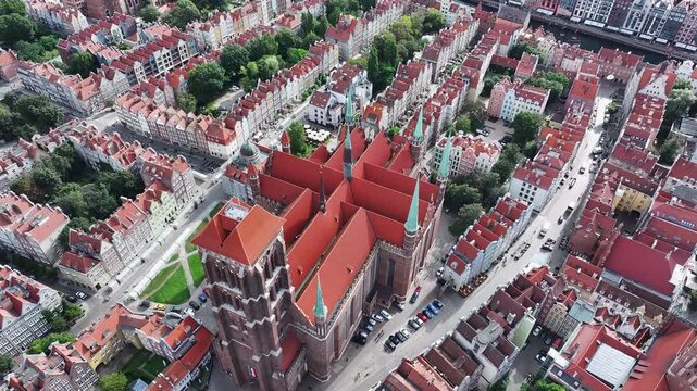 Aerial Gdansk Poland city center Cathedral over 4K. Baltic coast of northern Poland. World War II started here with German invasion. Economic international port. Historical buildings, tourism.