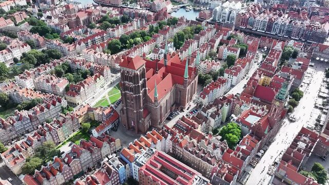 Aerial Gdansk Poland city center Cathedral tilt down 4K. Baltic coast of northern Poland. World War II started here with German invasion. Economic international port. Historical buildings, tourism.