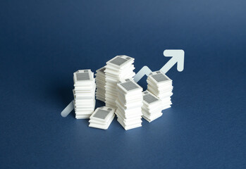 Stacks of papers and an arrow pointing up. Increased bureaucracy and regulation, rising...