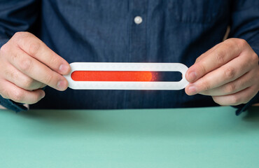 A man holds a progress bar filled to 75 percent. Work on the home stretch. Timeline almost full,...