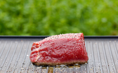 cook preparing fresh raw beef fillet mignon steak