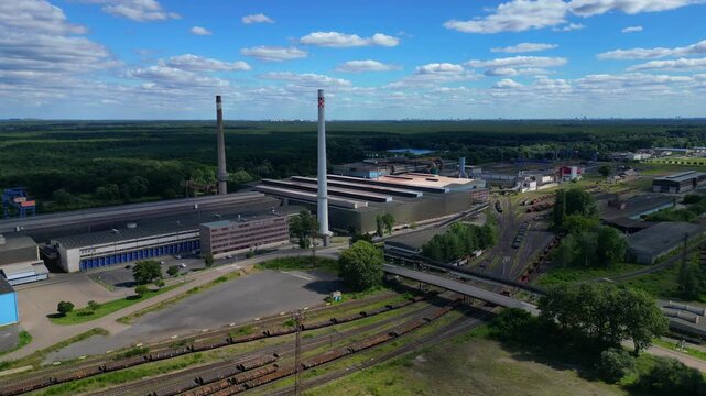 big Steel Mill, chimneys and railway network. Magic aerial view flight drone
