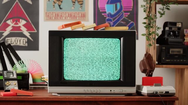 Old television with gray screen at home. Close-up of vintage tv in living room, nostalgia. Searching channel, bad signal. 