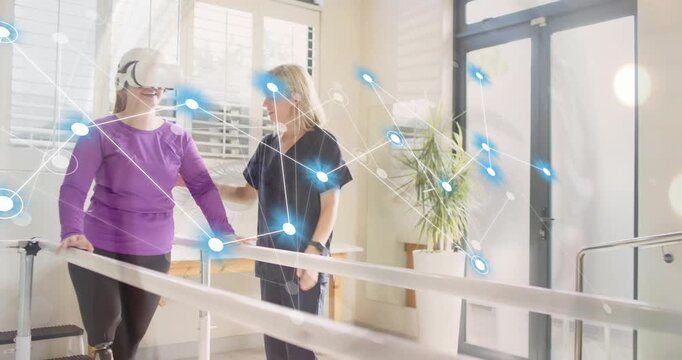 Patient raising VR headset in rehab walking with prosthetic along bars as therapist guiding network
