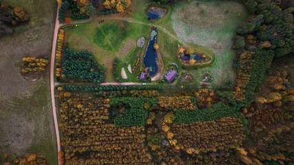 Aerial View of Rural Landscape with Ponds and Red Roof Buildings