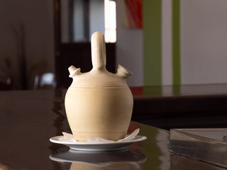 Traditional Ceramic Wine Pitcher on a Bar Counter