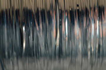 abstract silver tinsel thread spool