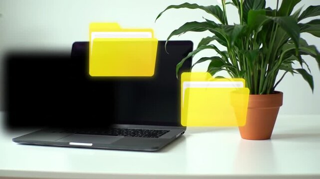 Digital file transfer concept with laptop and floating folders with modern workplace.