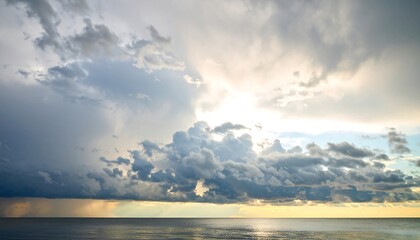 Dramatic Storm Clouds Over Calm Ocean Horizon with Sunlight Breaking Through.