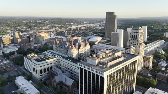 Drone orbits from the north to the west side of Empire State Plaza at sunset in Albany, New York, USA