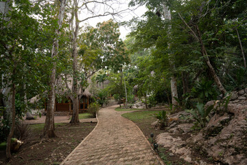 Garden Pathway with Fountain and Thatched Huts, Yucatán Mexico
