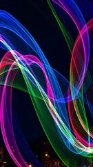 Abstract light trails swirling in vibrant colors