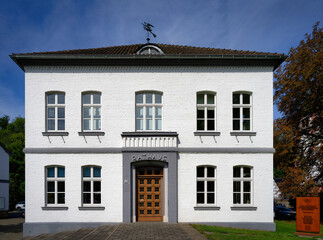 Town hall of the small town of Odenthal in the Bergisches Land region on a sunny day with blue skies