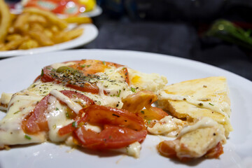A slice of pizza torn apart on a plate