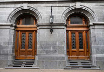 The image shows large wooden doors, details of the architecture of the large buildings of Buenos...
