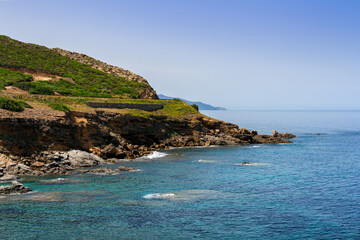 Naklejka premium Breathtaking view of Costa Verde in Sardinia, Italy, featuring crystal clear turquoise water and rocky coastline