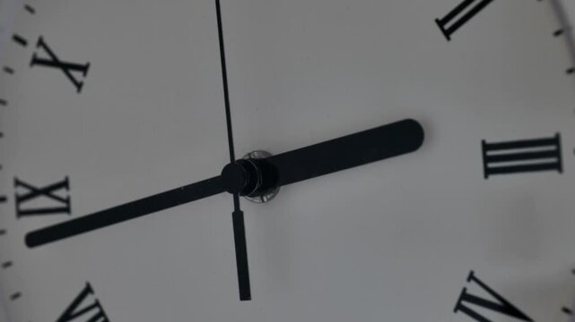 Running of time concept. Clock dial with running hands and Roman numerals. Fast motion video. 4k footage