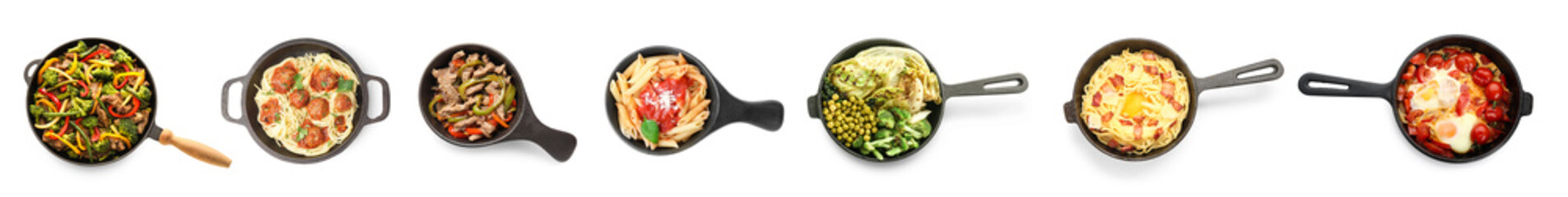 Set of frying pans with different cooked dishes on white background, top view