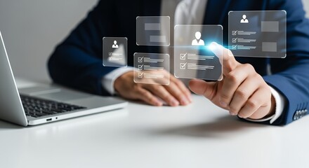 A person in a blue suit touches a digital interface showing user profiles with checklists and progress bars next to a laptop User interface Technology