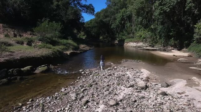 Drone shot of the Guarda do Cubat&atilde;o river in the Atlantic Forest near Palho&ccedil;a, Santa Catarina, Brazil. Capturing natural landscapes and the serene environment. Horizontal video.