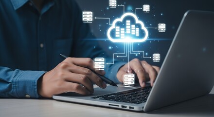 A person wearing a blue shirt uses a laptop while interacting with a glowing cloud computing network displaying server icons and interconnected lines Data