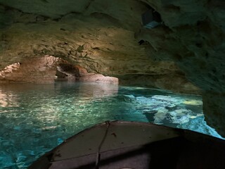 Underground lake and cave with boat 