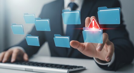 A businessman interacting with floating digital files one of which displays a red warning symbol suggesting data risk or error detection Technology Alert