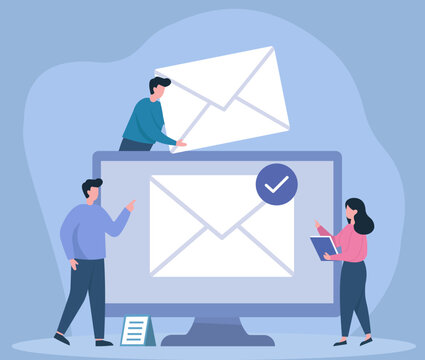 A team collaborates on an email marketing campaign, sending and verifying messages on a large computer screen for successful digital communication