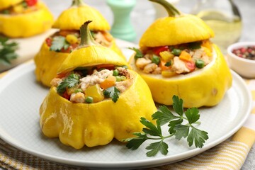 Tasty stuffed pattypan squashes on grey table, closeup