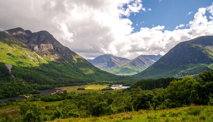 Obraz premium Majestic Green Valley Surrounded by Mountains Under a Cloudy Sky.