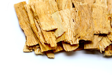 Dried Astragalus root slices used in traditional Chinese medicine.