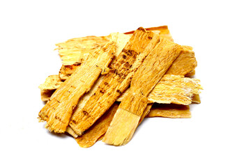 Dried Astragalus root slices used in traditional Chinese medicine.