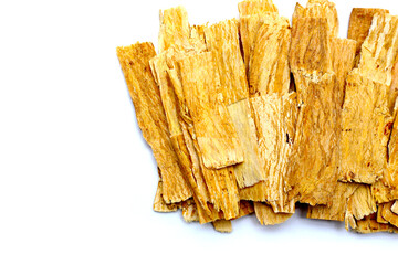 Dried Astragalus root slices used in traditional Chinese medicine.