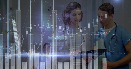 Standing tablet-holding colleagues analyzing financial charts in corridor, with skyline overlays