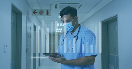 Doctor in scrubs wearing mask analyzing data overlay in hospital corridor, with stethoscope, tablet
