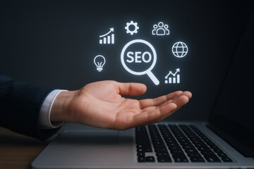 Hand Presenting SEO Optimization Concepts for Business Growth and Online Marketing Success on Laptop